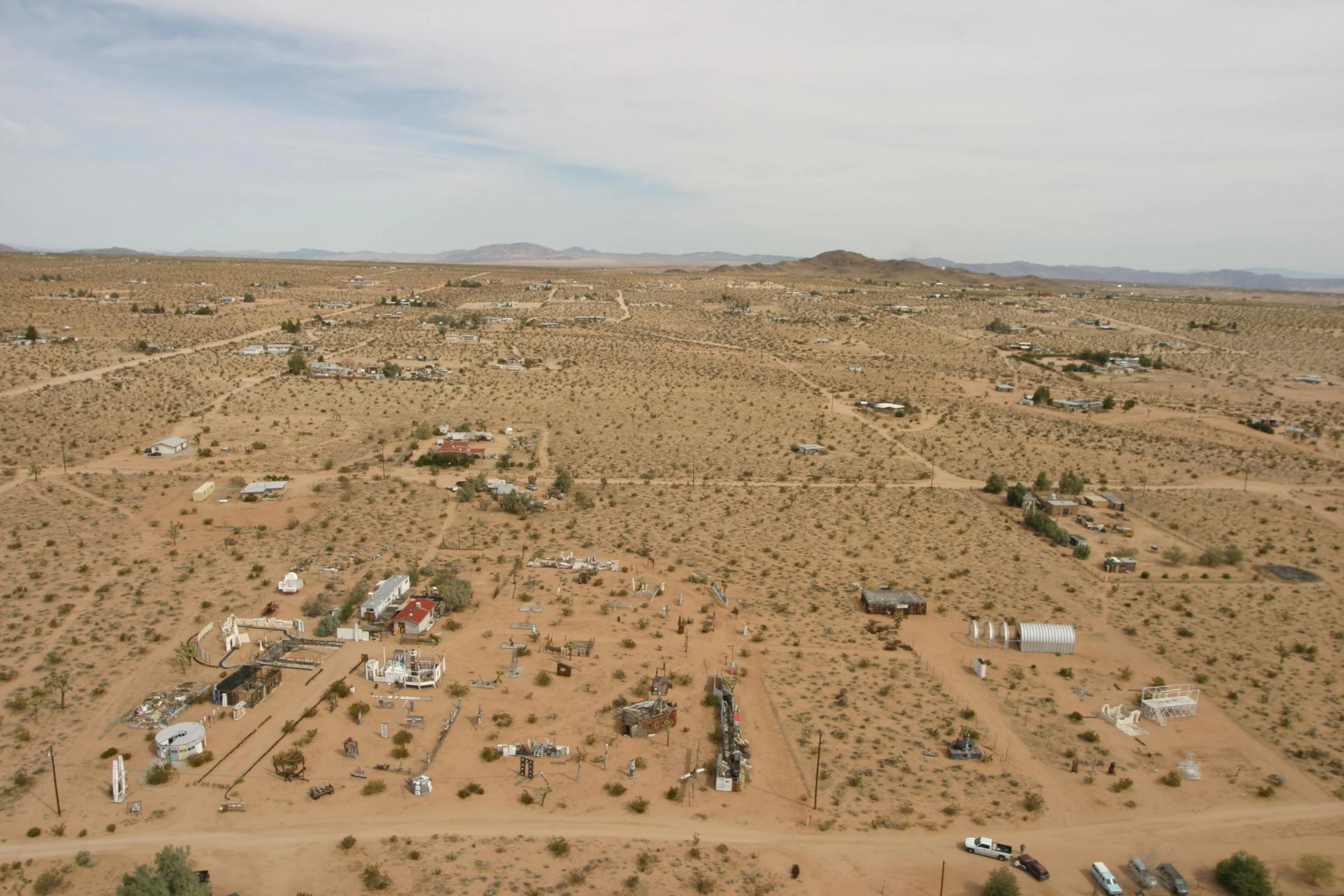Foreground: Outdoor Desert Art Museum of Assemblage Sculpture | Photo: Low Altitude Blimp Photography | www.lablimp.com
