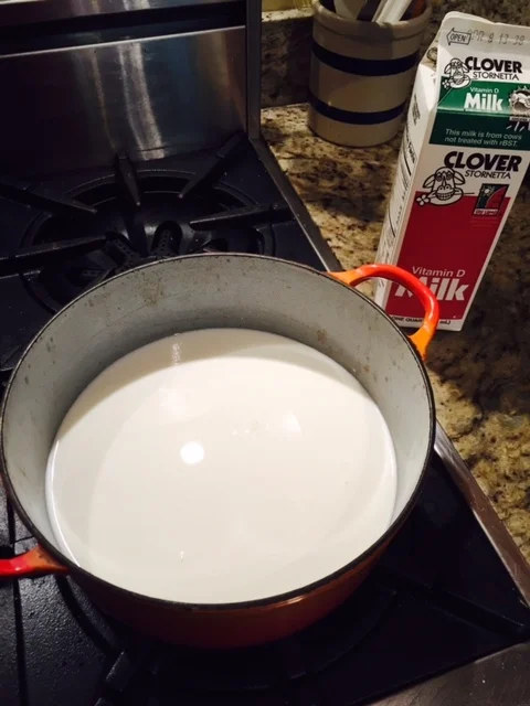 Start with pouring the milk into your pot. This pot is not metal: it has enamel over cast iron. That is okay!