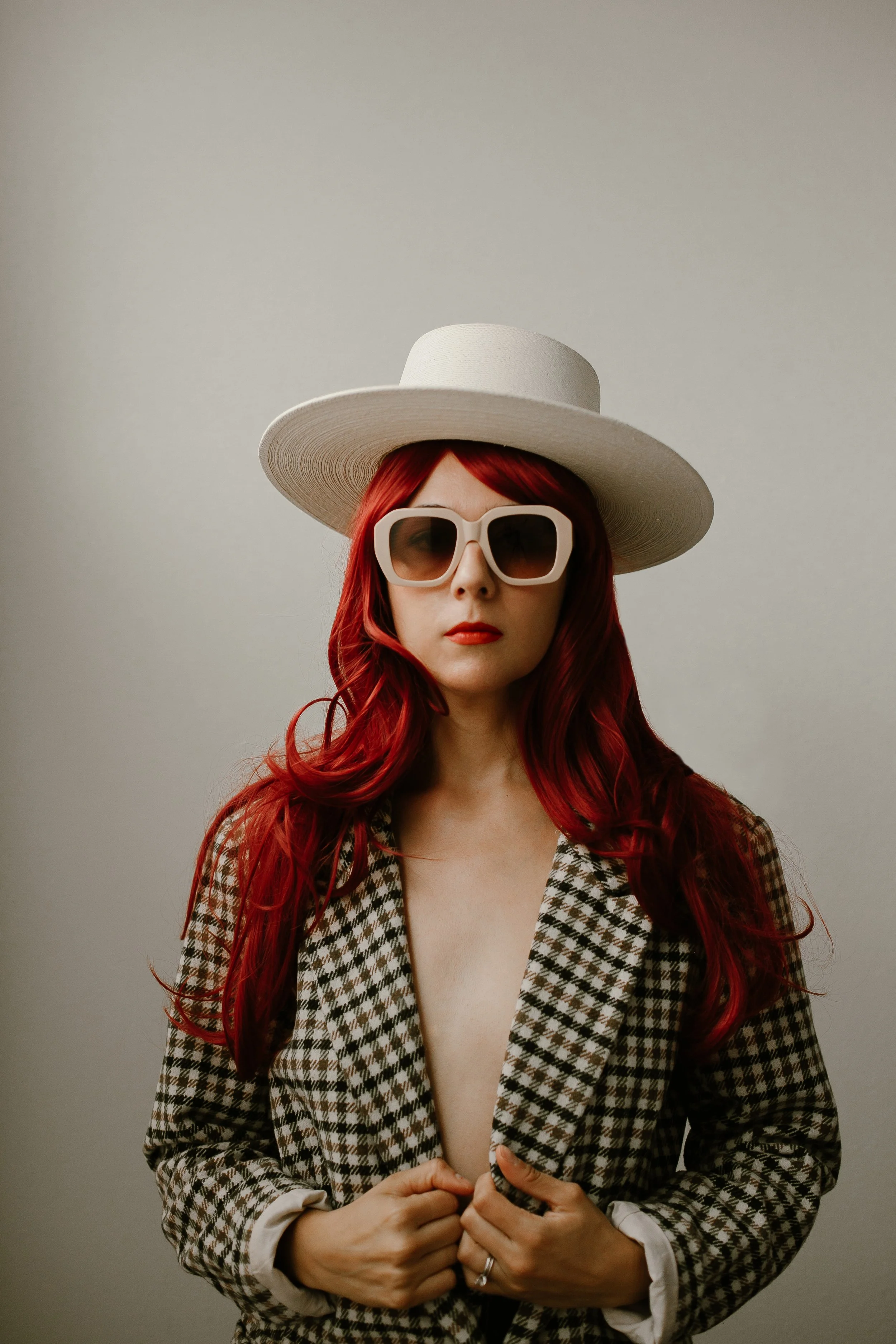 red headed woman wearing white hat.jpg
