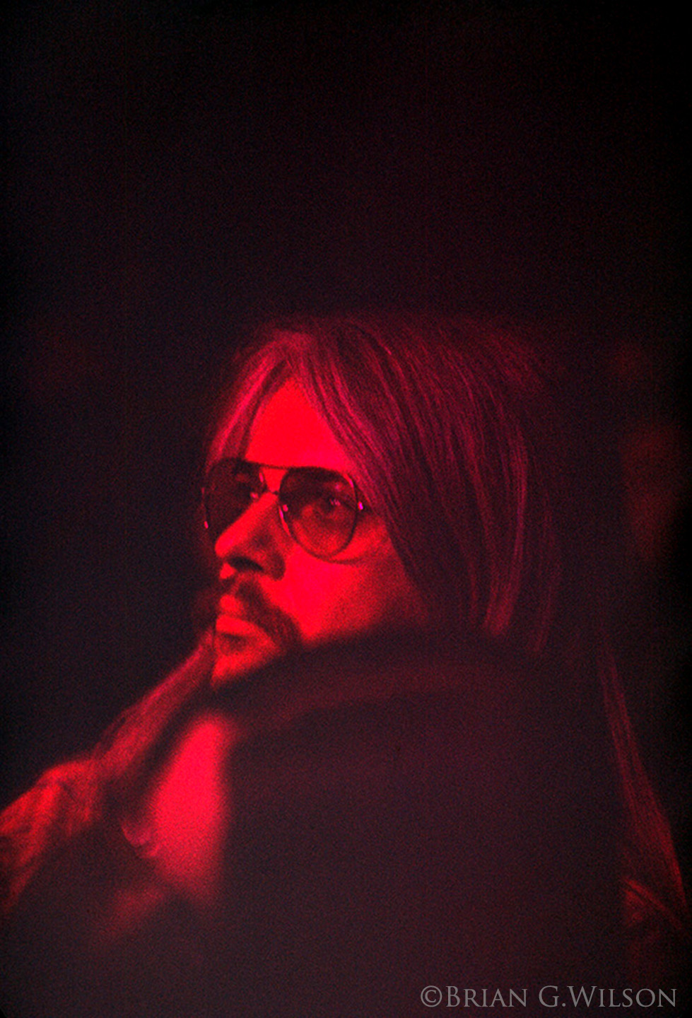 Leon Russell looks on prior to taking the stage for the second half with Billy and George.