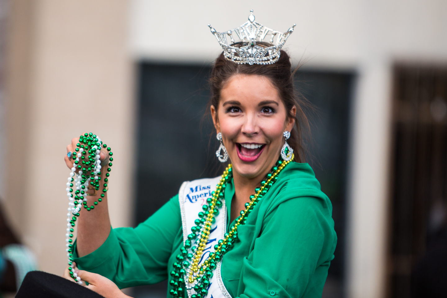 The adorable Miss Arkansas Loren McDaniels throwing me beads. I shot with the right hand, caught with the left!