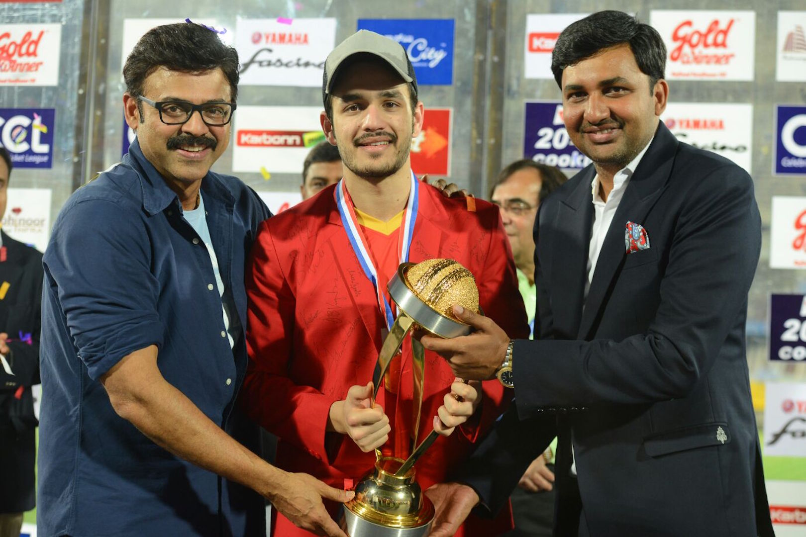 Winning Trophy- Akhil Akkineni, VEnkatesh Dagubbati and Vishnu Induri.jpg