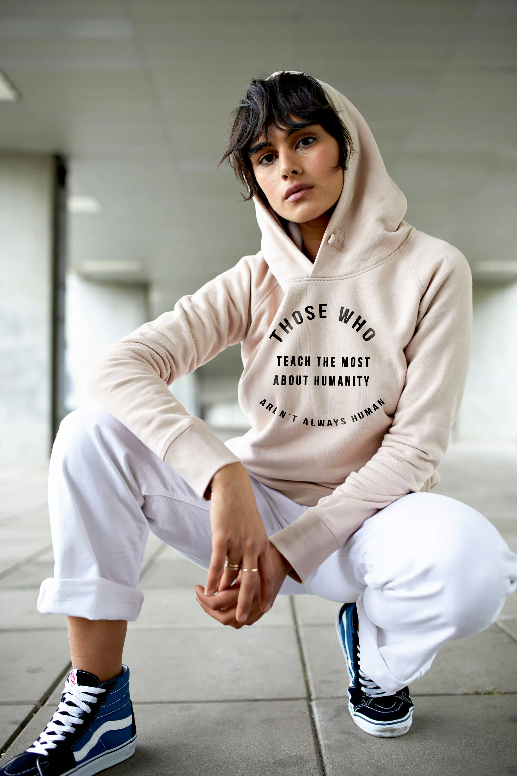 cream_hoodie_crouched_humanity.jpg