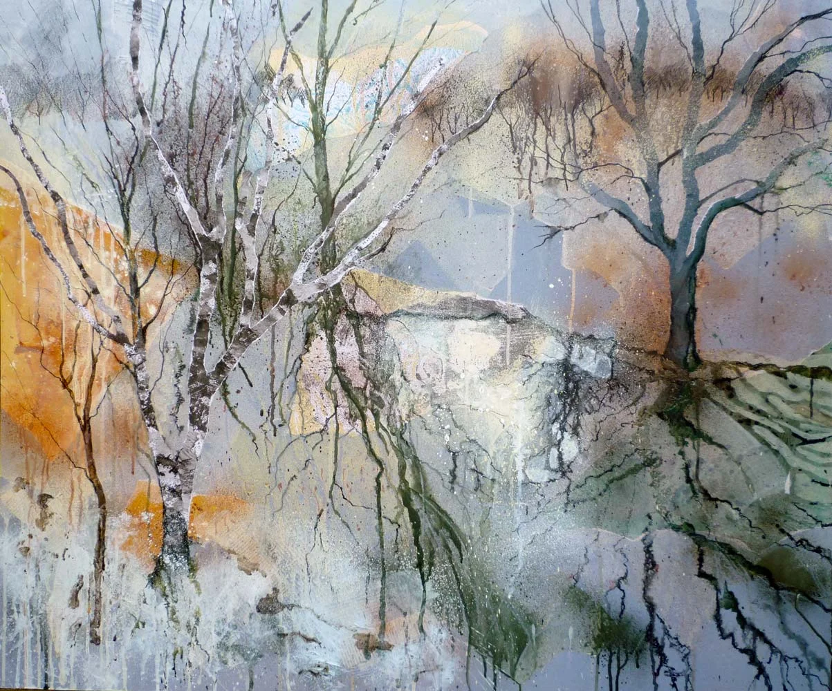 Winter trees reflected in the brook