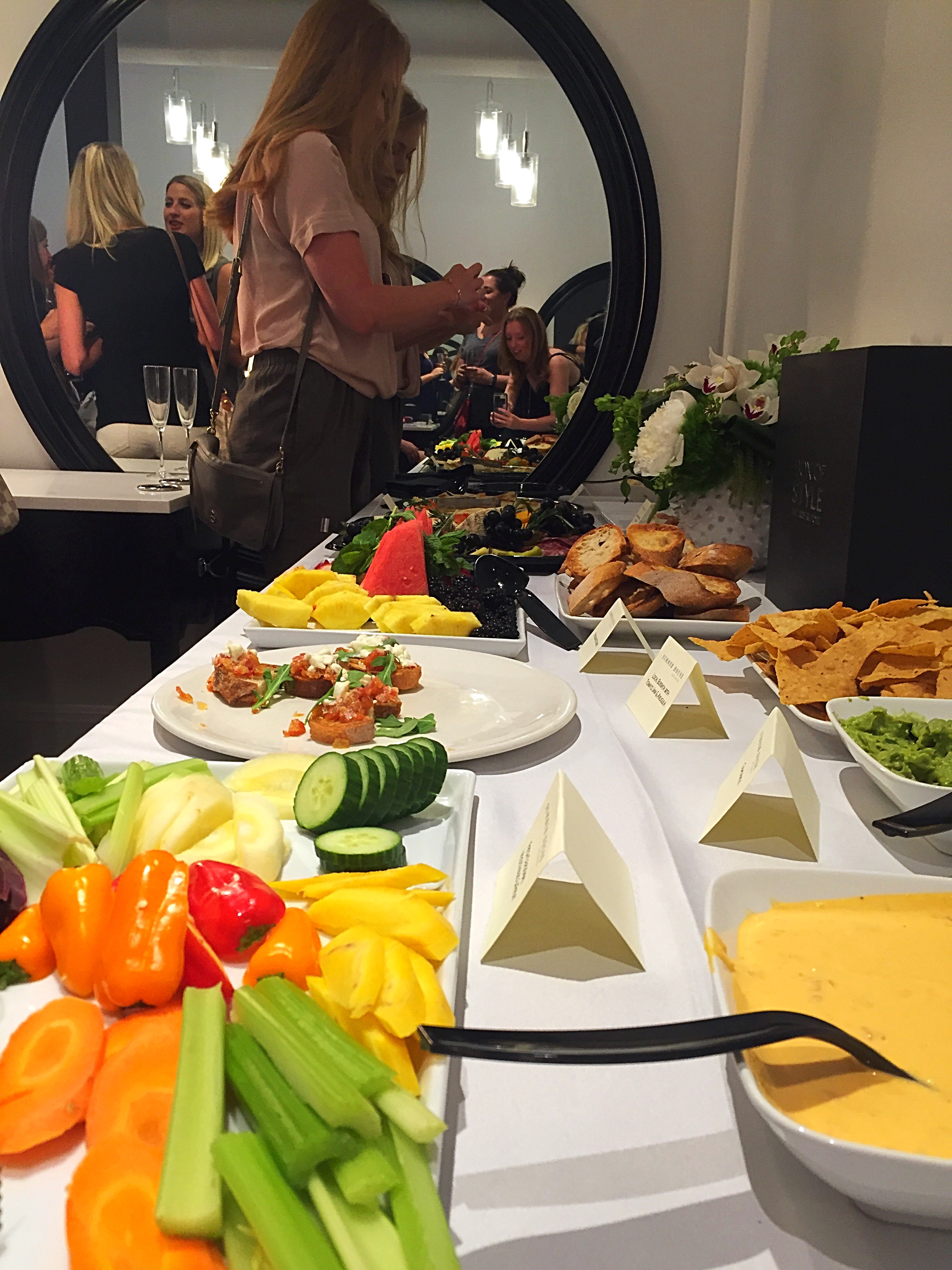A colorful spread of small bites! (With a cameo by Rachel and myself, if you look in the mirror)