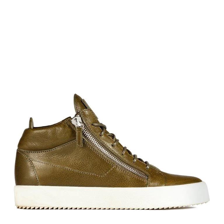 TAZ: A mid-top sneaker in olive green leather with lateral zips and a white contrasting sole. 