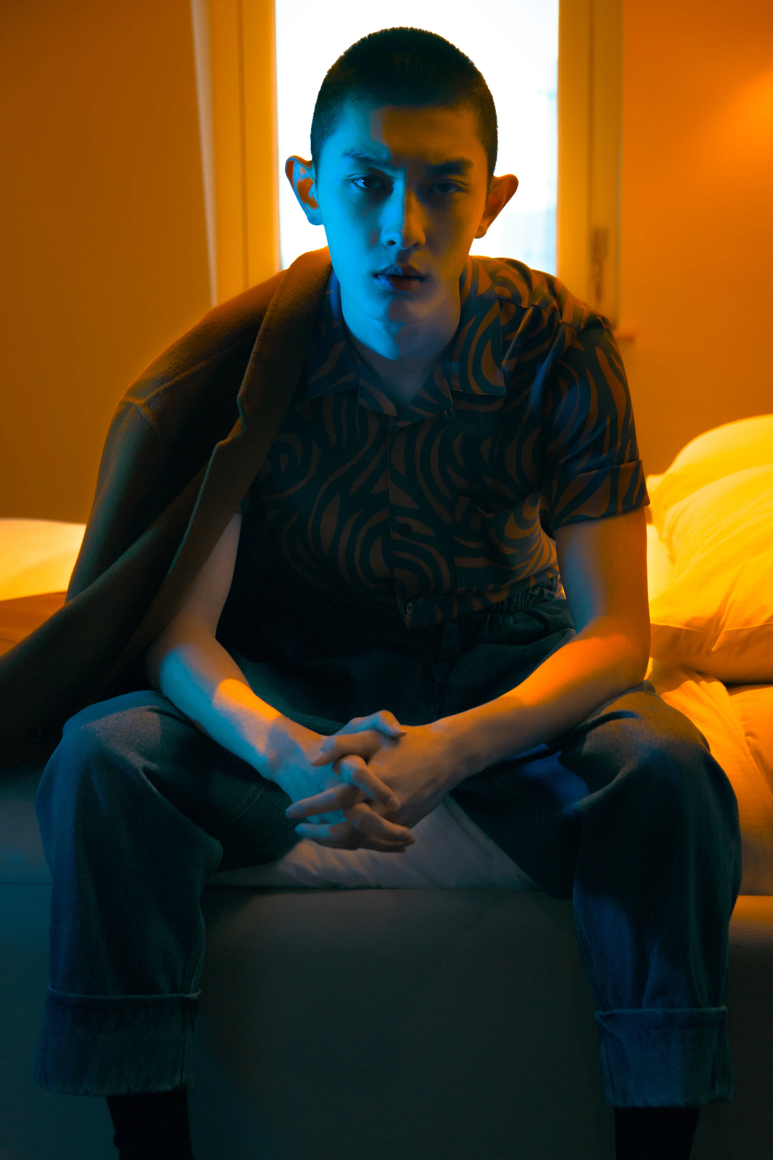 Coat Acne studios , Printed shirt WooYoungmi , Denim trousers J.W Anderson .