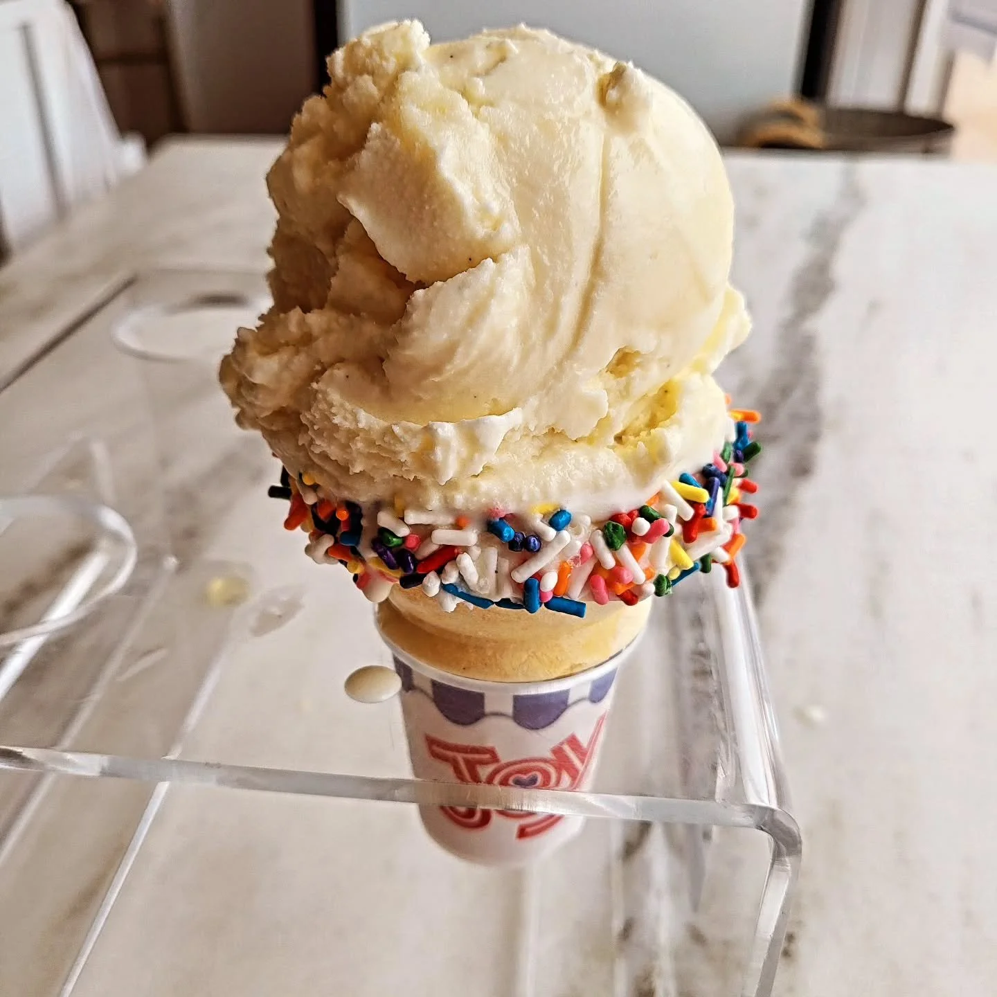 Anniversary special single scoop vanilla sprinkle cone. $3