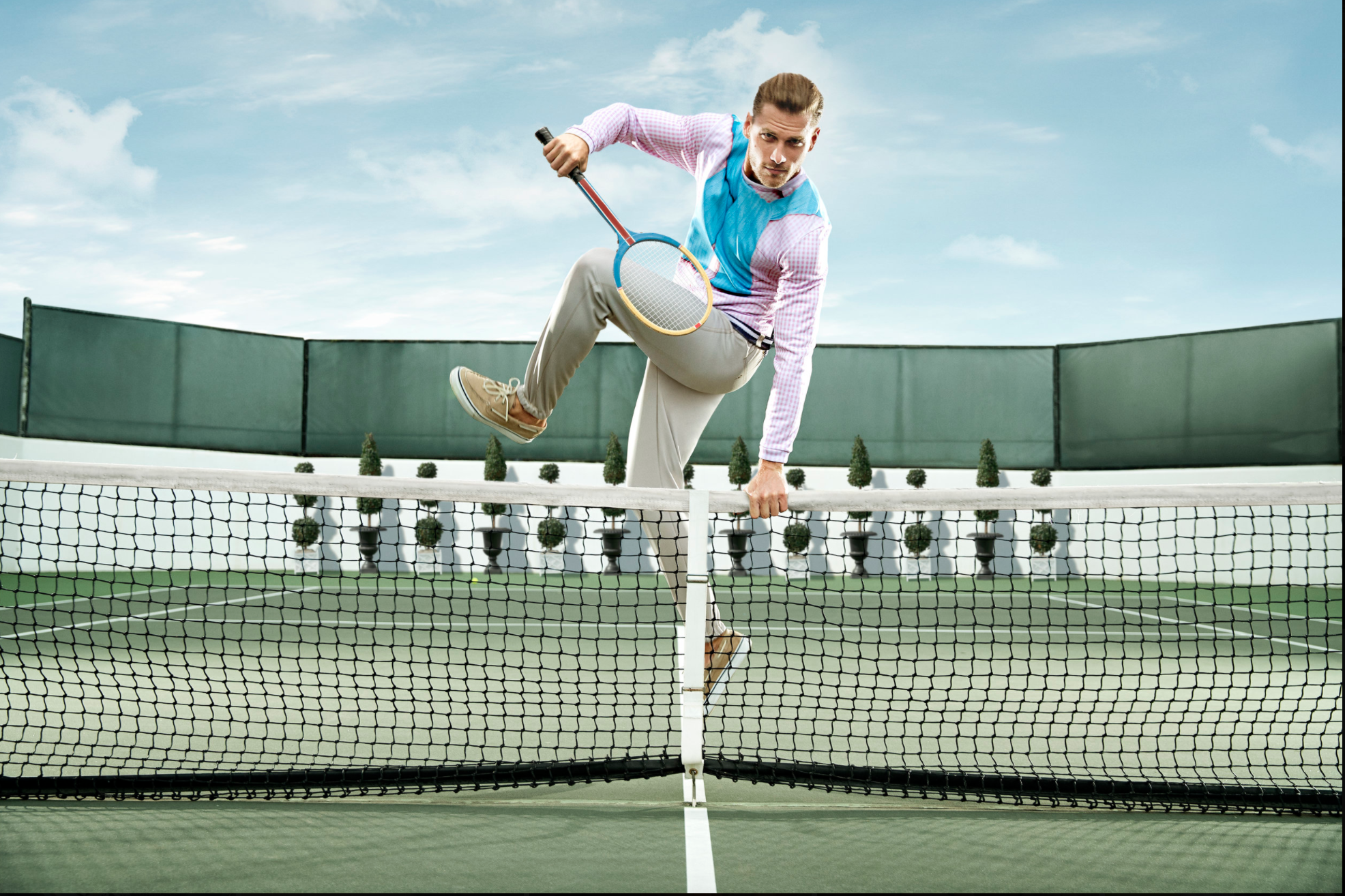  Fruit of the loom handsome man model jumping over tennis net 