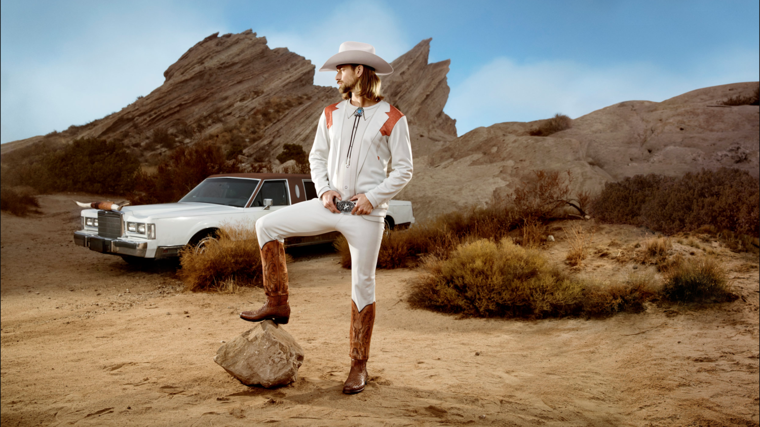 Fruit of the loom handsome cowboy in desert with vintage limo and big horns 