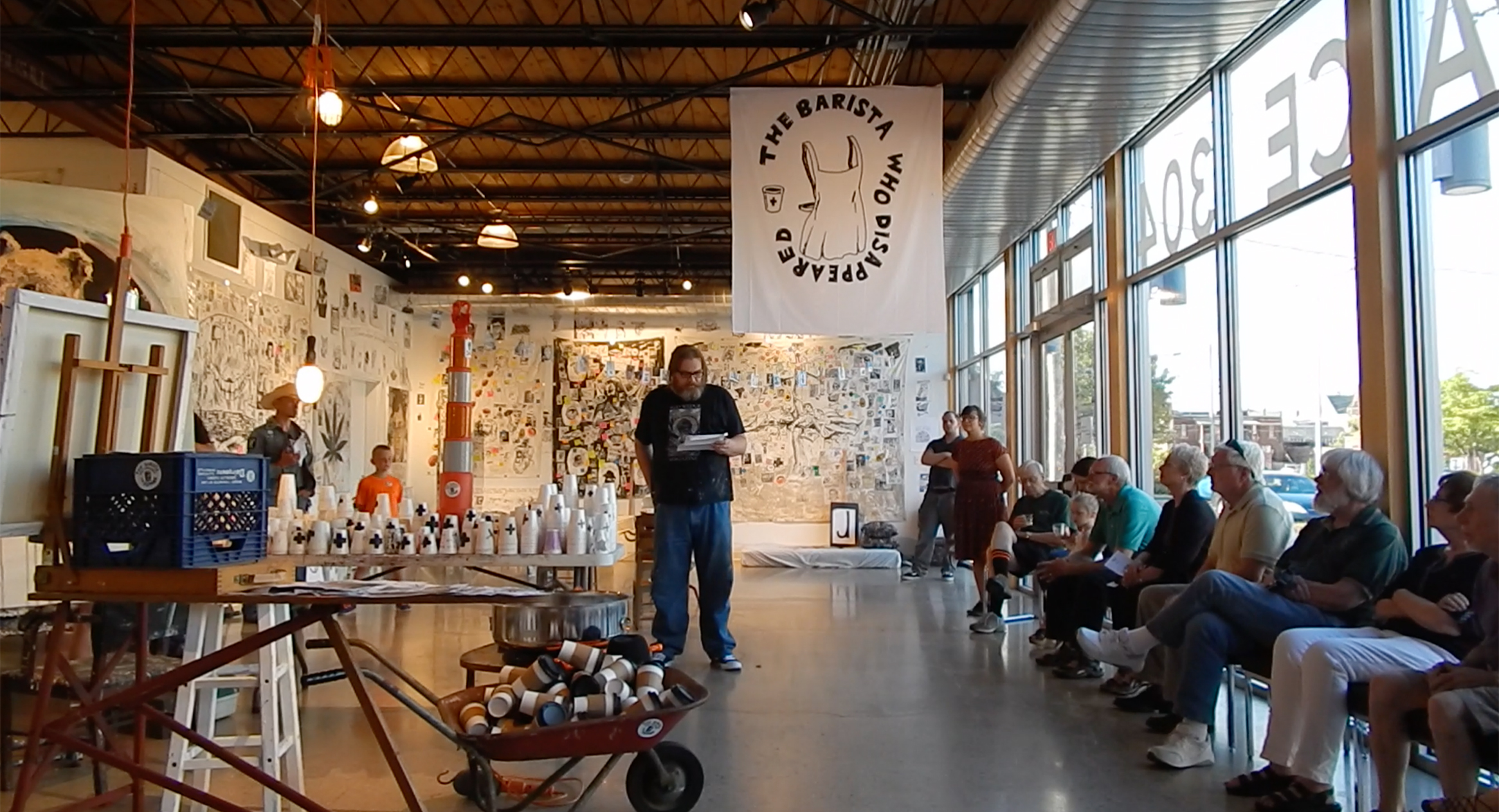 Artist talk at the opening of The Barista Who Disappeared at Artspace 304 (Carbondale, Illinois) (Summer 2018).