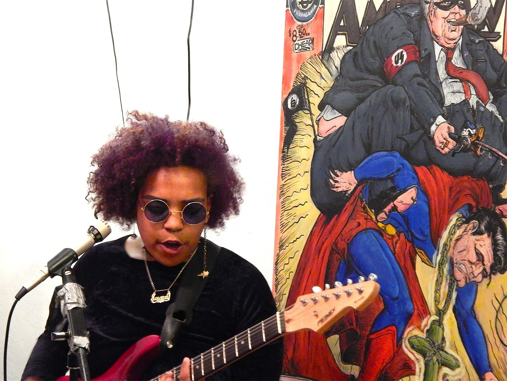 Hard Times Art Show II with Jesa Dior Brooks at the Dollar Art House. Artwork in background by Jon Cornell. (2016)