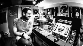 This is Cameron Henry, mastering engineer, whose picture apparently comes up if you Google "mastering a record". He recently mastered a record for my band Rosaline. He does amazing work, is easy to work with, and is not crazy expensive. welcometo1979.com