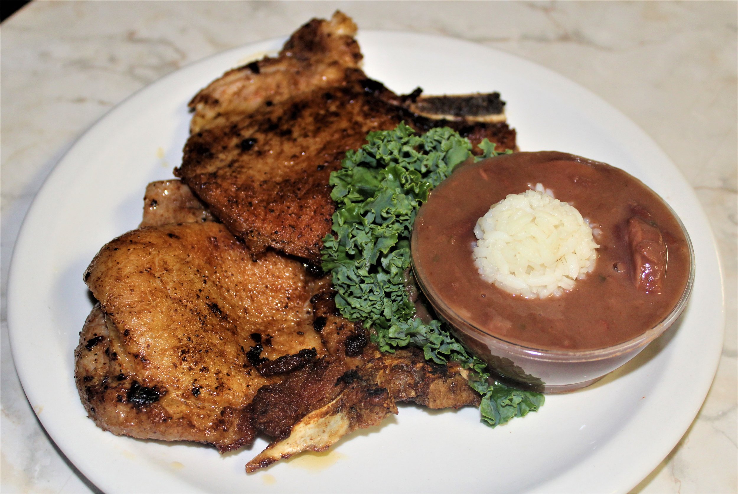 Pork chops with red beans and rice.