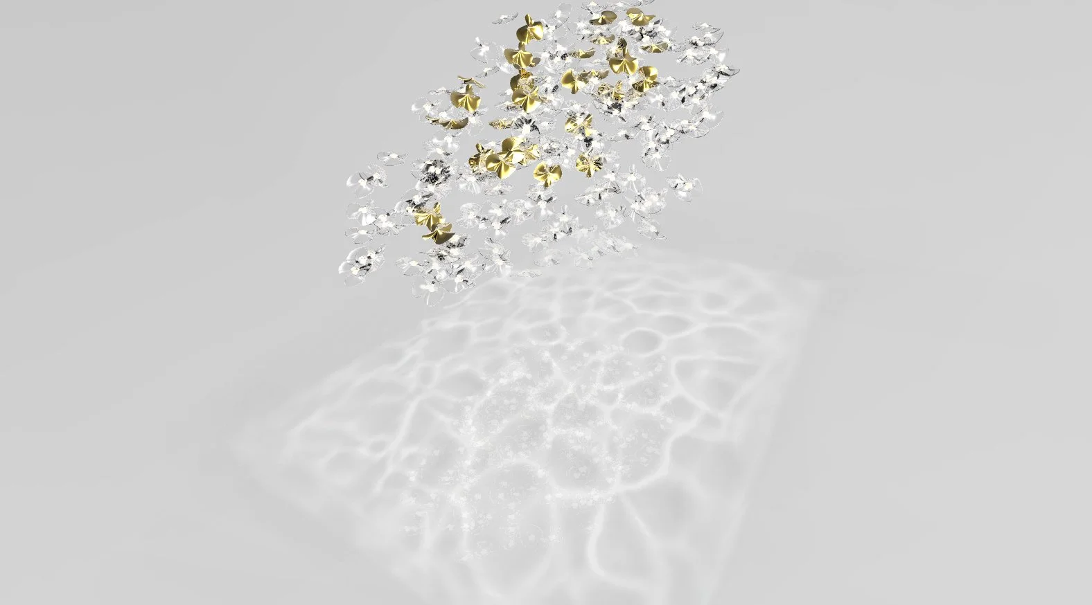 James Russ modern Cartier chandelier with clear and gold-colored glass or crystal pieces hanging from a reflective surface, casting intricate light patterns on the surrounding area.