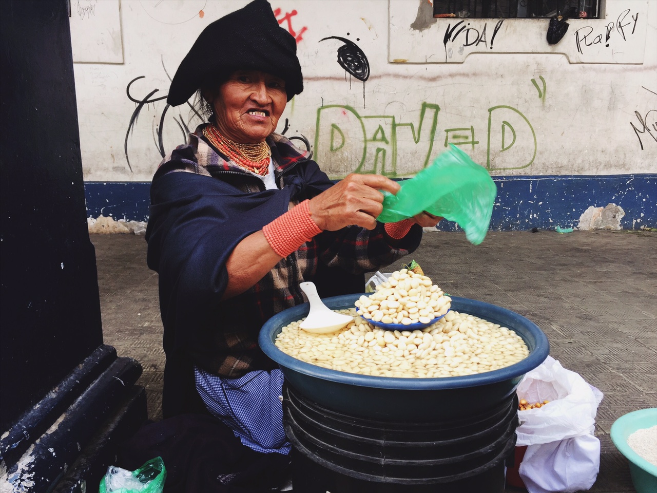 Purchasing legumes from a woman in Otavalo, Ecuador