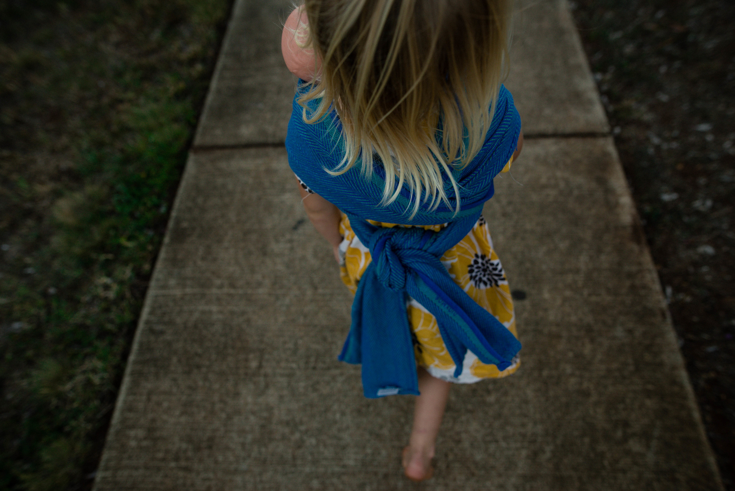 wrapped baby doll in didymos lisca
