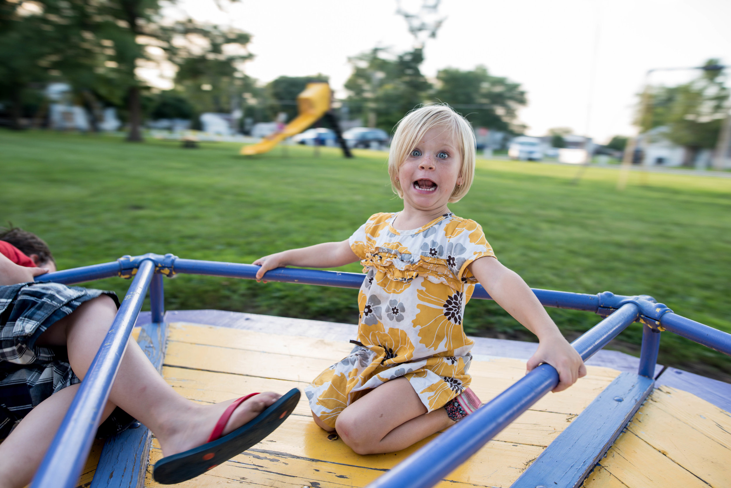 child on merry go round at williamsville illinois park
