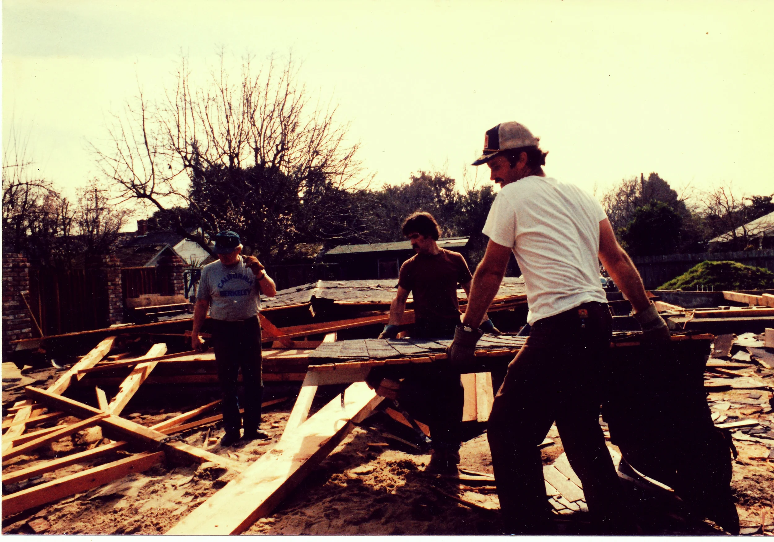 Pictured right to left: brothers John and Robert, and their father Paul working on a house in Palo Alto in the 1970s.