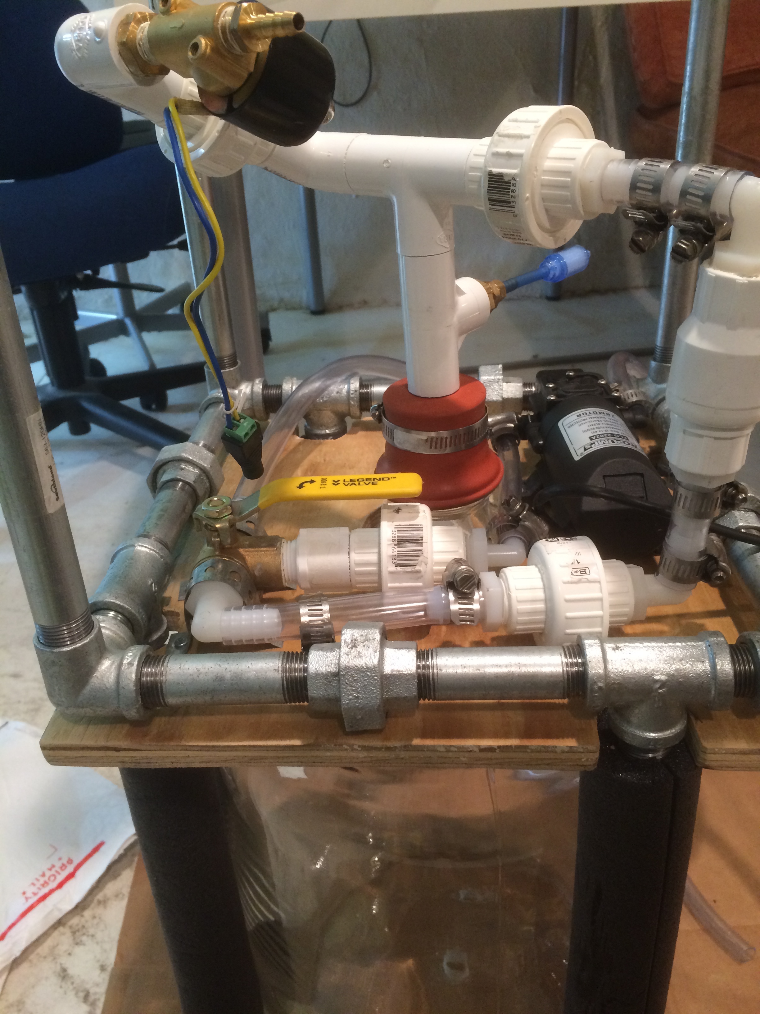 A diaphragm pump was chosen to circulate the liquids because they are self-priming and less-detrimental to bacterial populations than centrifugal pumps. 3-way valves controlled flow & filling (manually) and a solenoid valve controlled the dispensing of the liquid culture.
