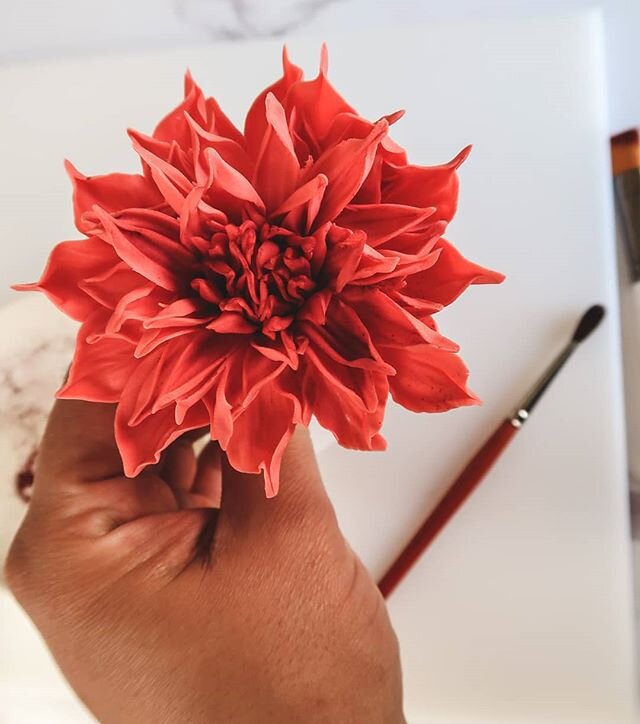 Head over to YouTube and on my channel Cake Me By Surprise you can learn how to make this realistic gumpaste Dahlia.
#cakedecoratingmagazine #cakedecoratingvideos #caketutorial #gumpastetutorials #sugarpasteflowers #sugarroses