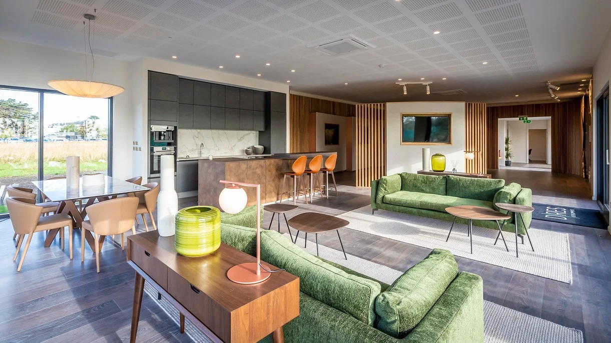 A purpose-built marketing suite showcases both the development, as a whole and its desirable location, integrating key elements such as a living kitchen, lounge/meeting areas & bathrooms, with palette & materials setting the standard for a comfortable yet aspirational style of contemporary living.