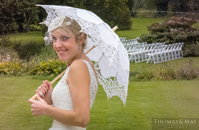 30 bride posing with a parasol.jpg