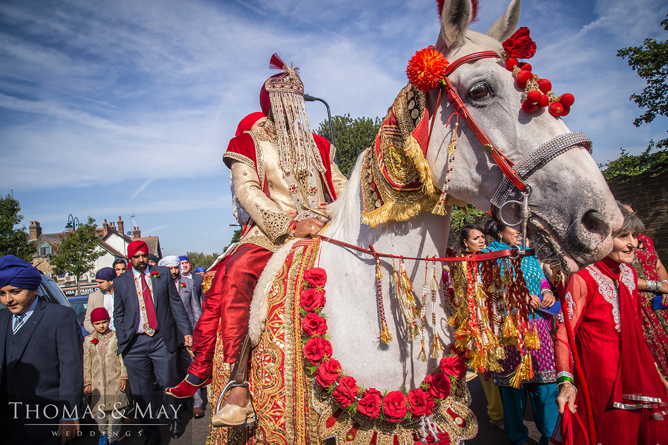31 wedding groom on a horse.jpg