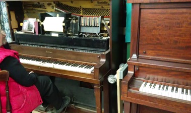 Woman using Pedals on Player Piano, Tech Works!, ImAge by Libby Norton