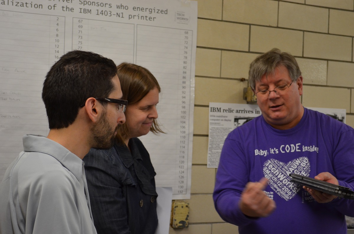 Bob Lusch explains print train to LJ Strumpf Jamie Martin.jpg