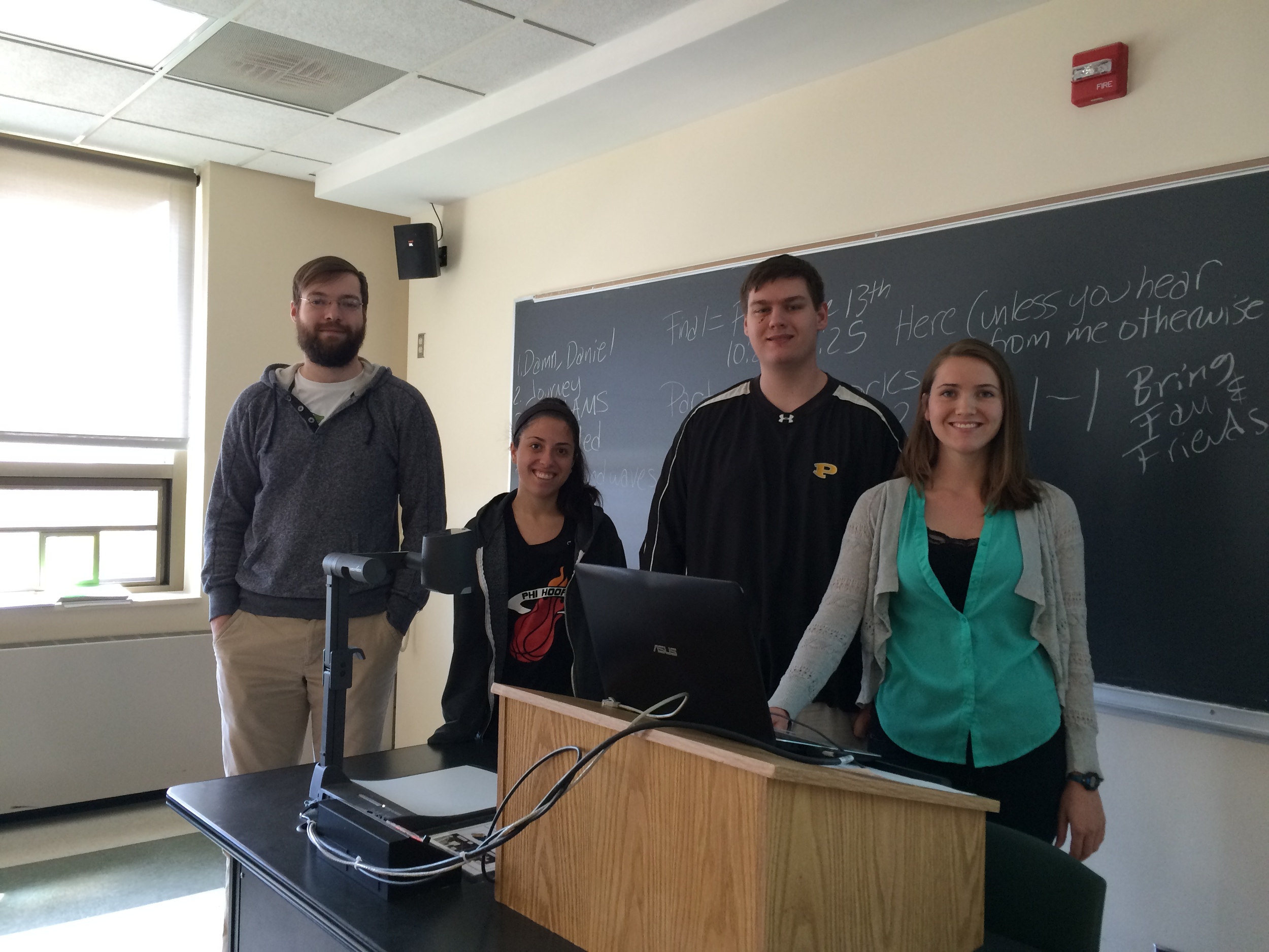 DESIGNERS OF THIS AURAL POSTCARD PRESENTING ON THEIR RESEARCH (L-R): Samuel Titus, Alyssa Liebowitz, Mackenzie Young, and Jaimie Girnis