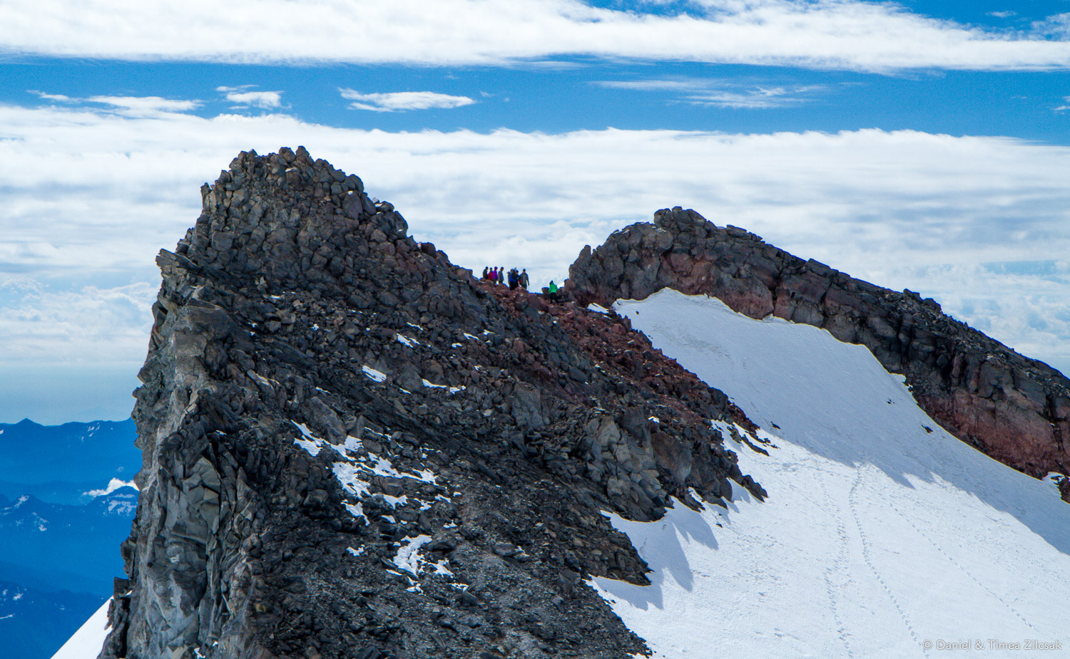 Camp Muir: climbers practicing mountaineering skills on the steeper slope below