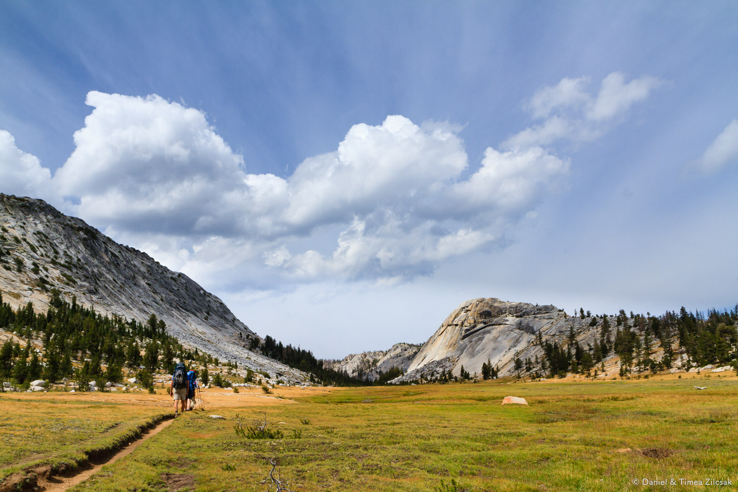 Backpacking across a beautiful meadow on our way to Merced Lake,