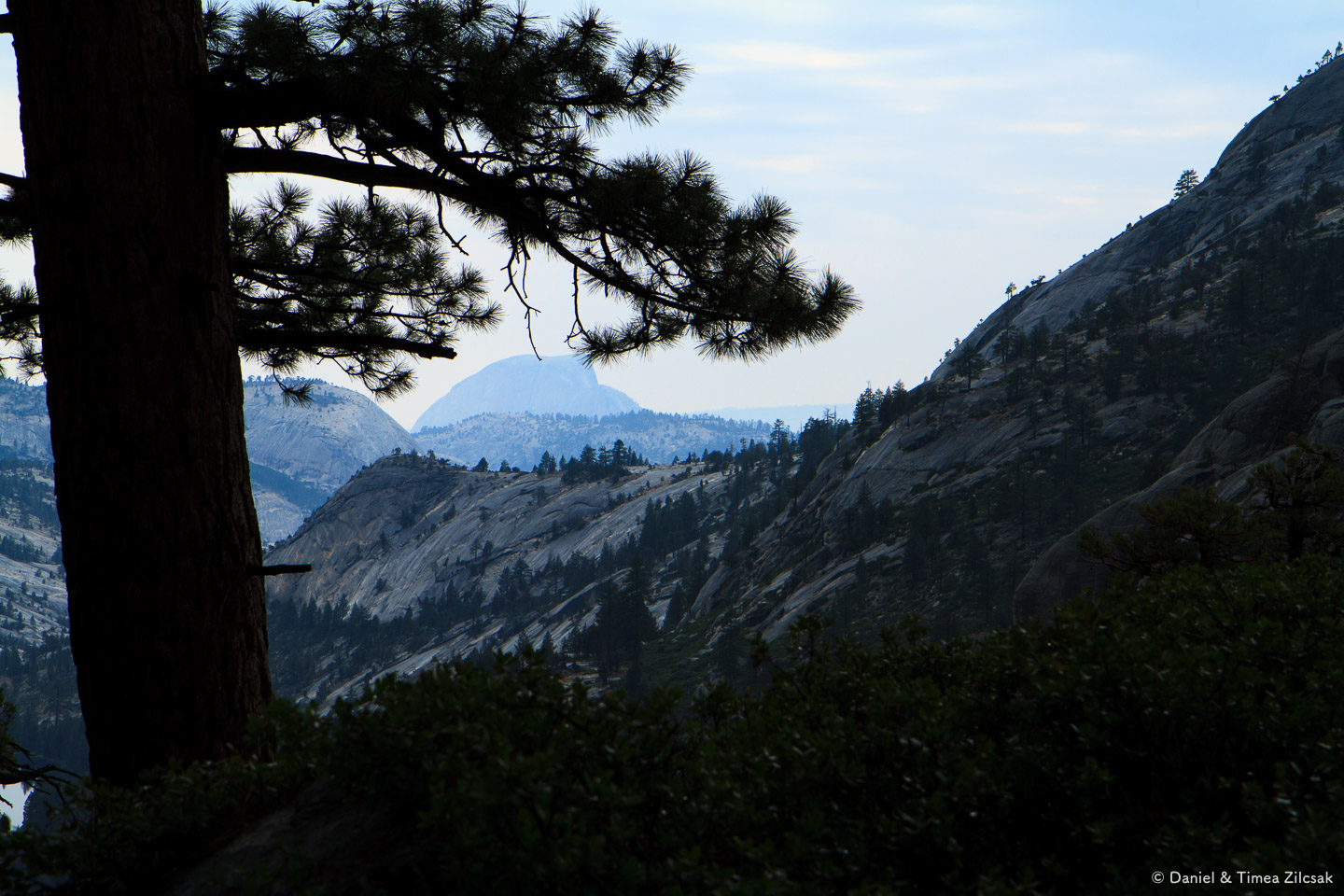 Half Dome far away in the distance, view from the trail descending into Merced Lake - Backpacking Yosemite
