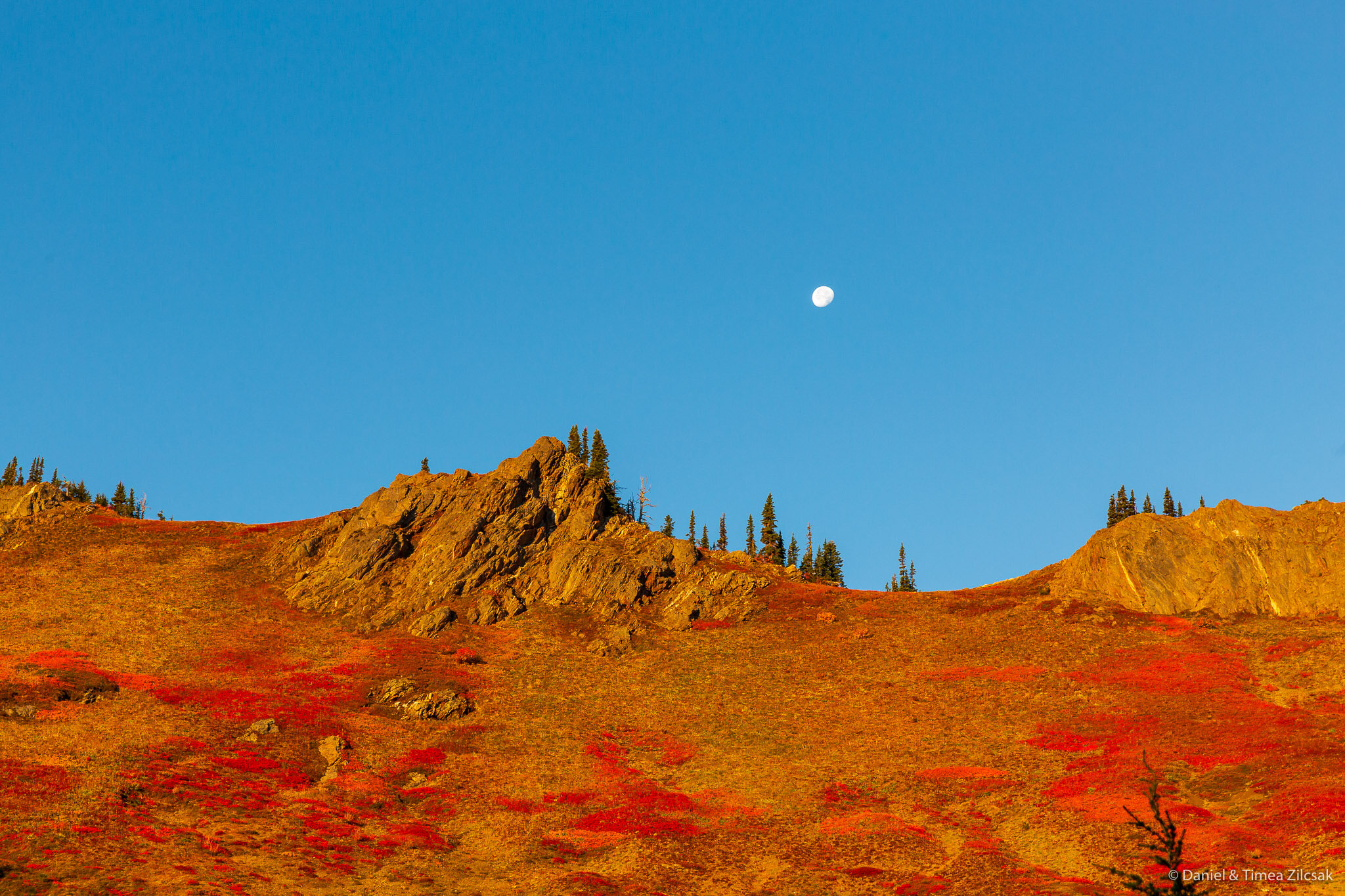 View of the Moon right above Little Giant Pass in the morning light 