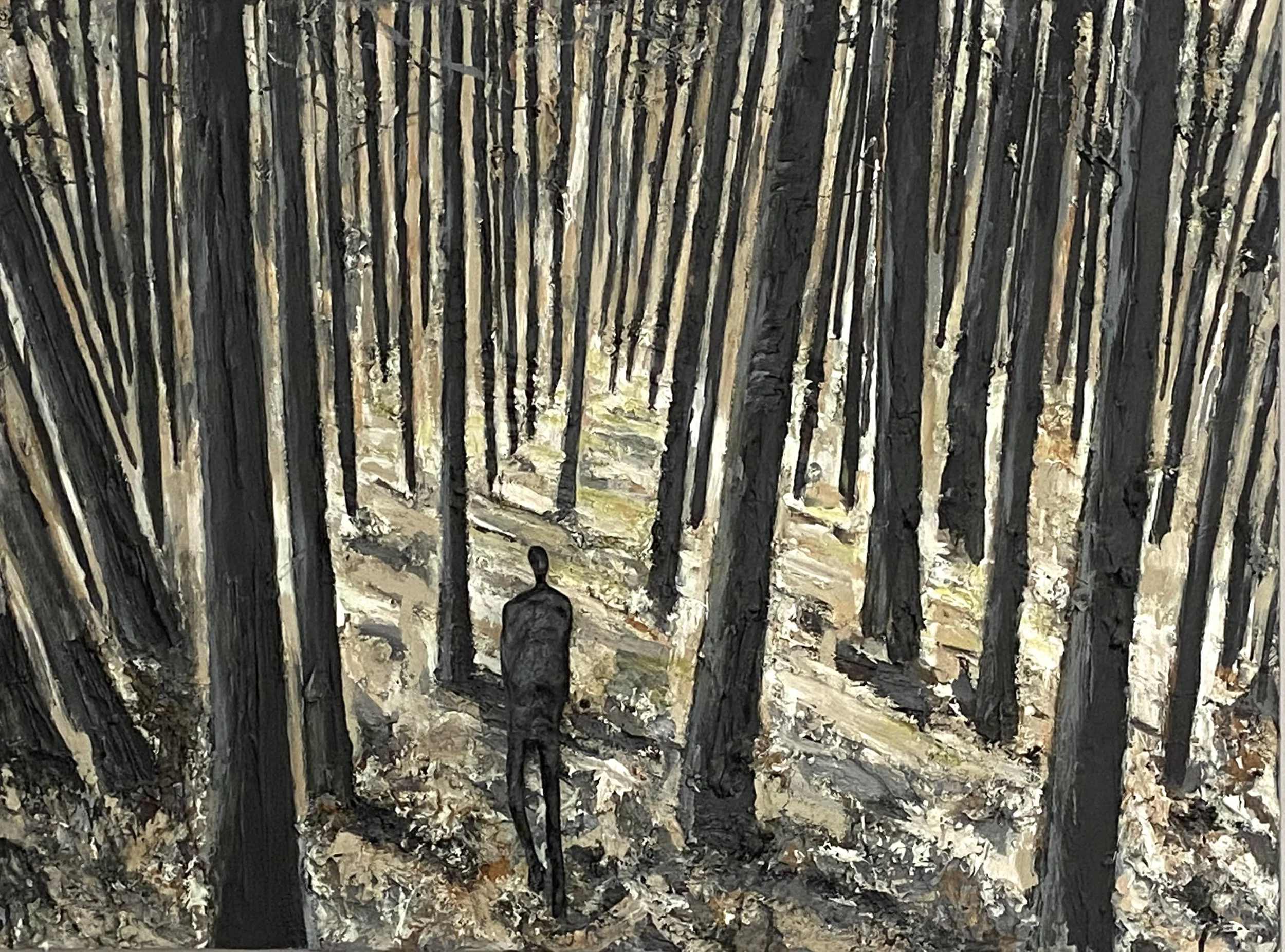 between birches with esculpture