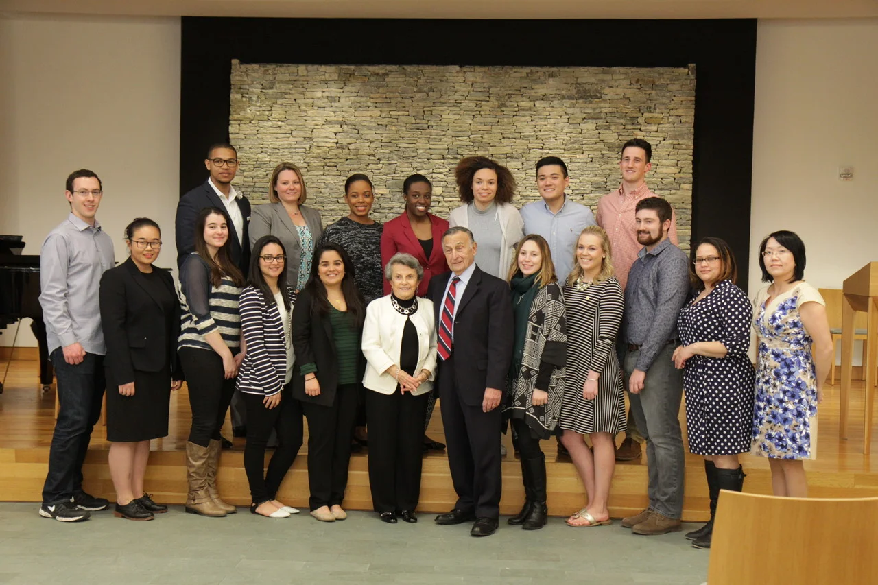 NEW MINISTRY: George and Mary Agostini, parishioners of Our Lady Queen of Martyrs Parish, Seekonk, pose with student and staff participants of a recent alternative spring break trip. 