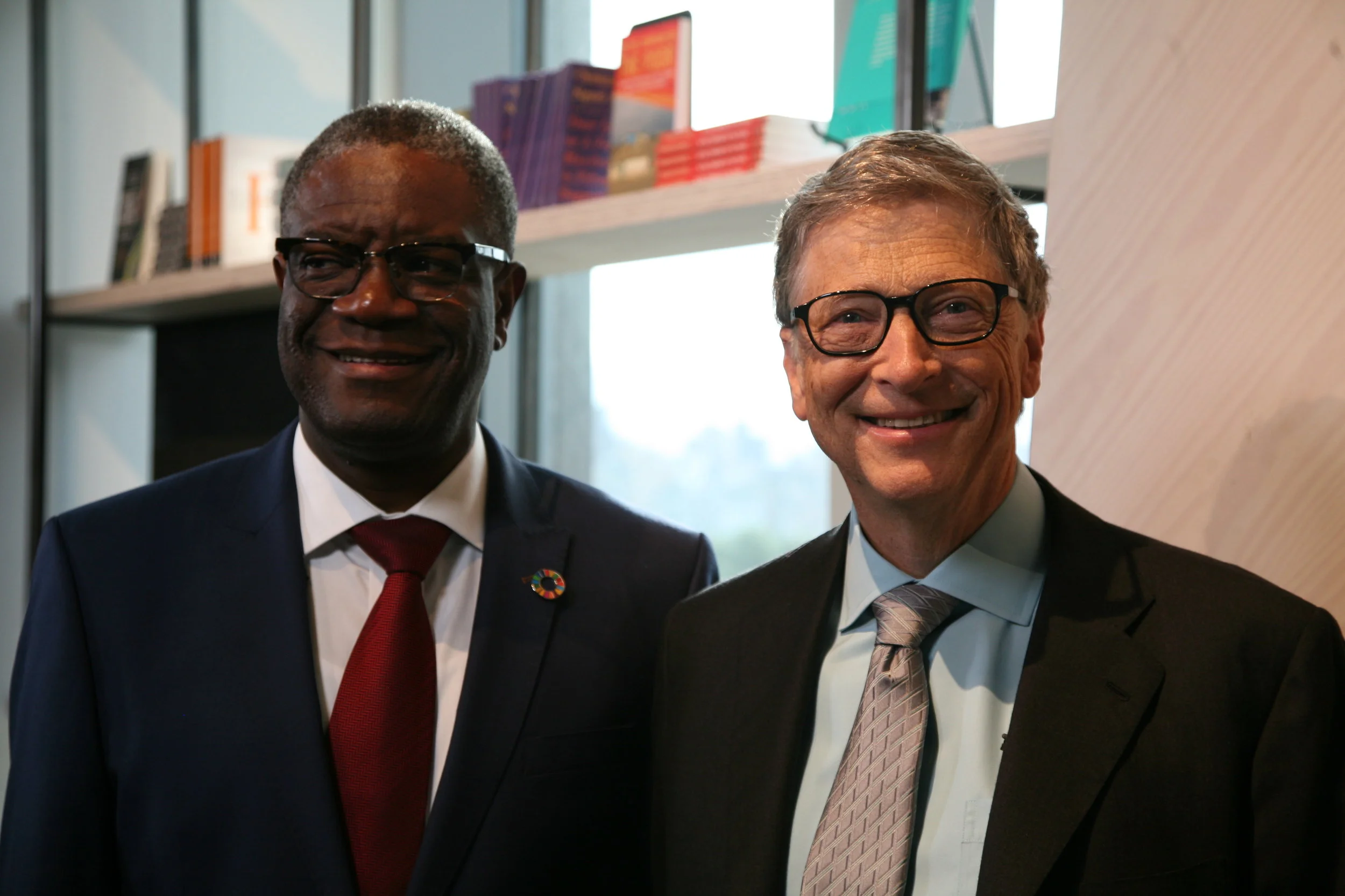 Photo of Dr. Denis Mukwege with Bill Gates, both men in suits and smiling for the camera.