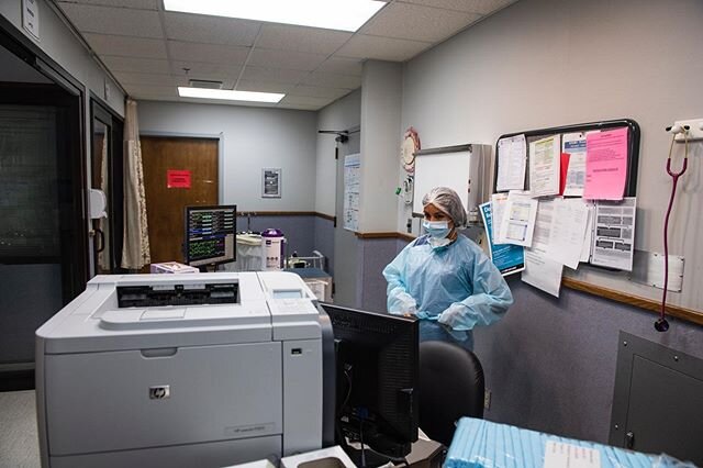 A nurse preps to walk into a room with a COVID-19 patient in the COVID unit of the Moore County Hospital. On the day I was there Moore County had two patients hospitalized for COVID and one was being sent home that day. Once the nurse is done checkin