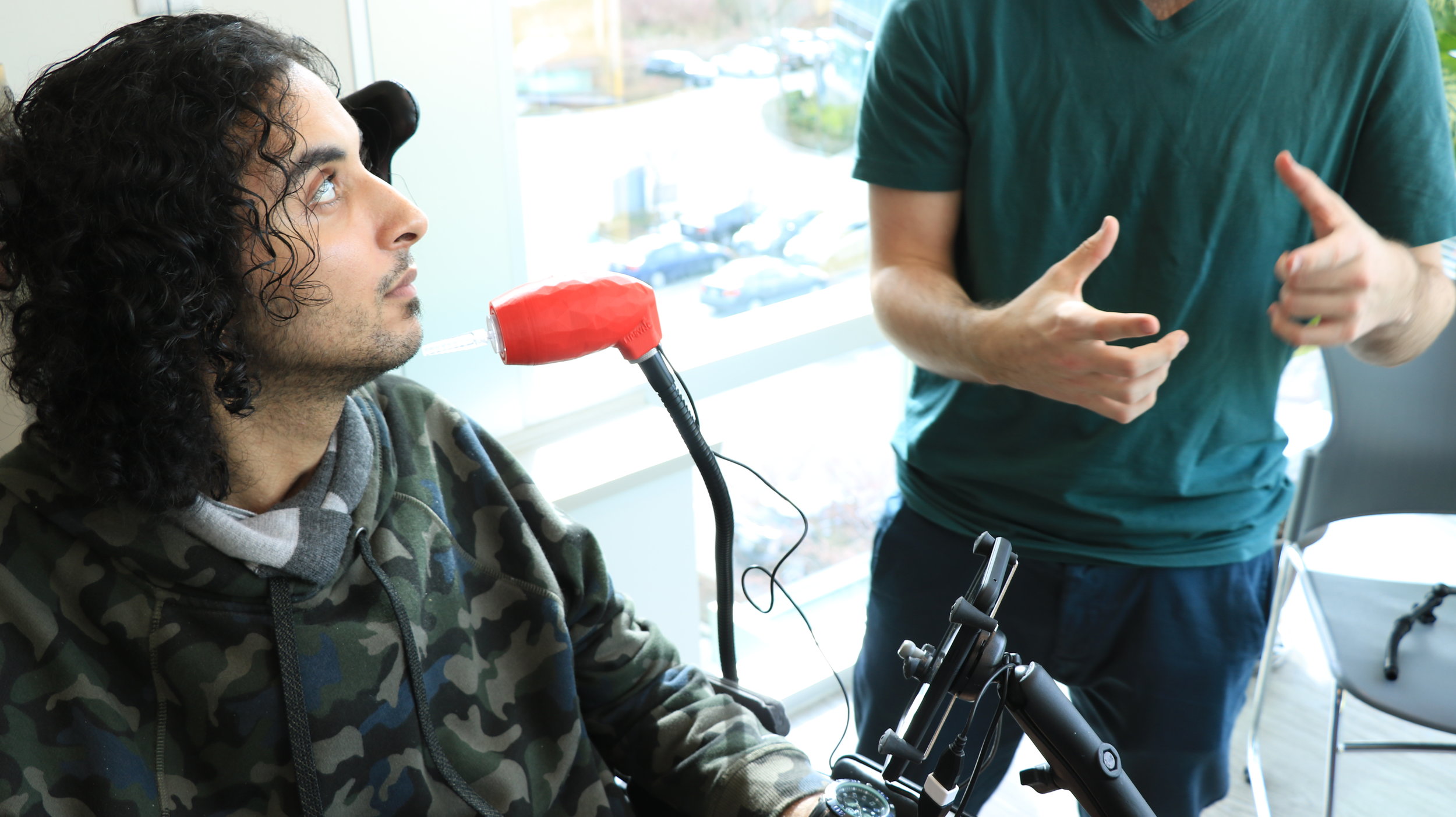  This is our second user. He is seen in this picture listening to an explanation of our solution. 