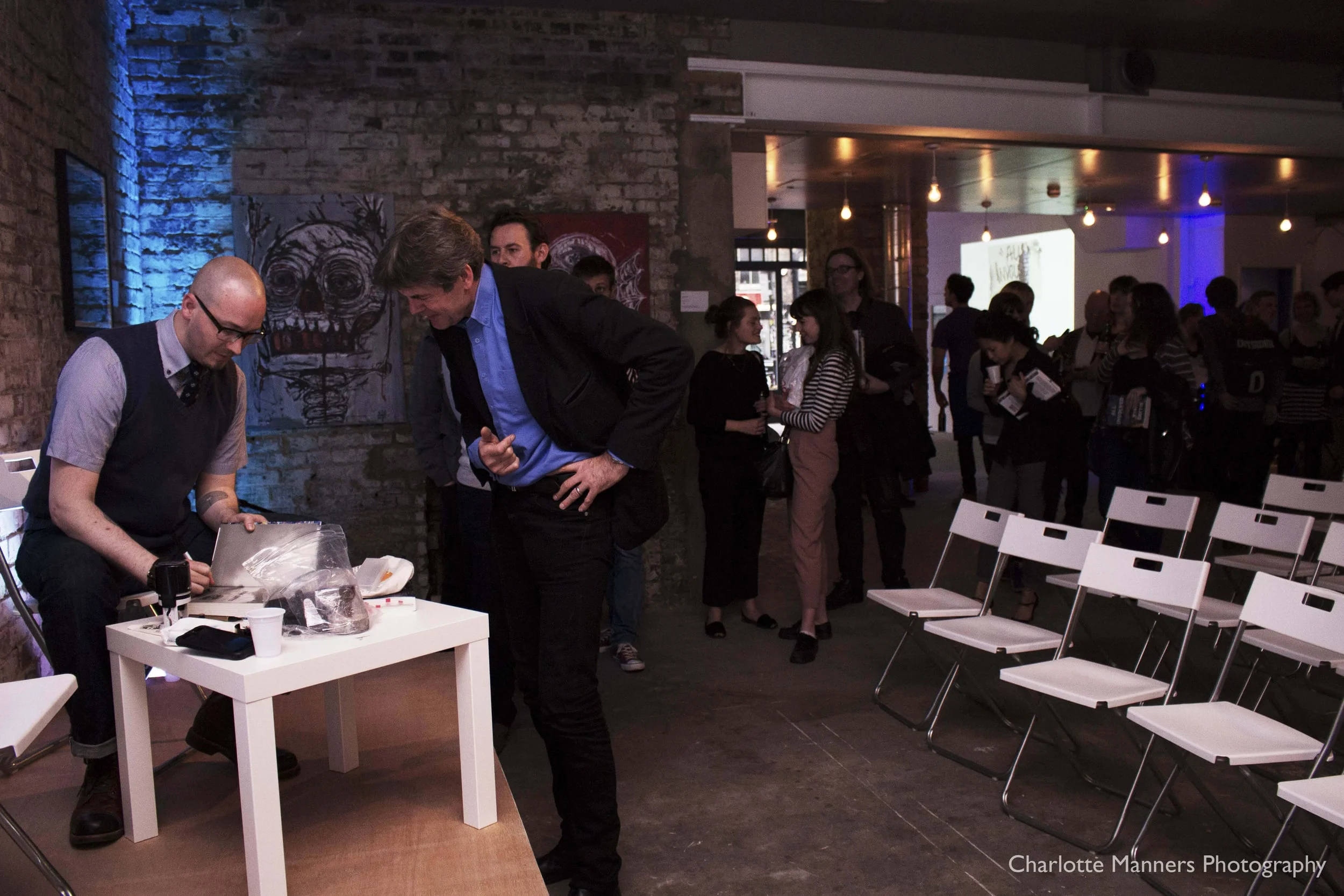 Ryan Gattis signs copies of All Involved in East London, 2015.