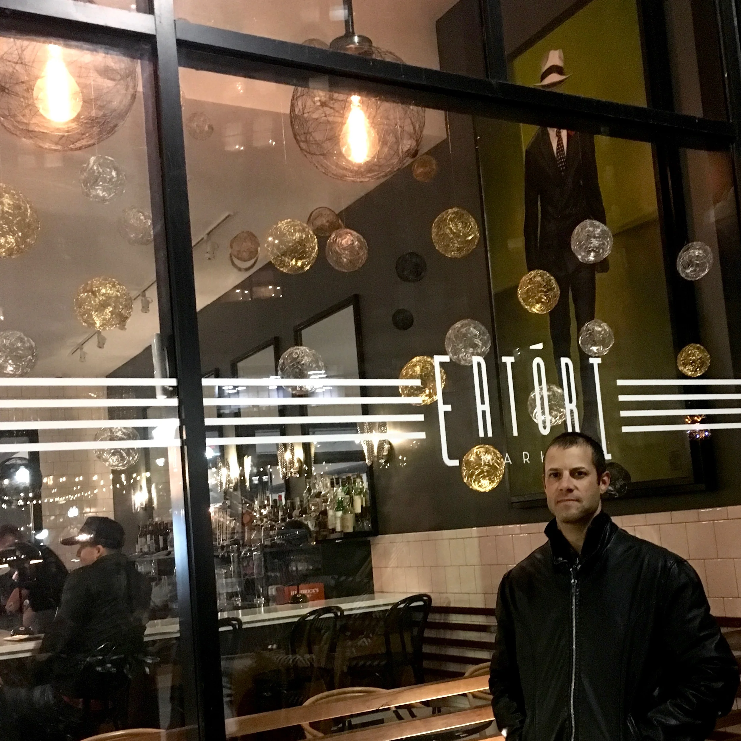 Mike O’Reilly stands in front of his 2018 Detroit Holiday Window Walk display, at Eatori Market.