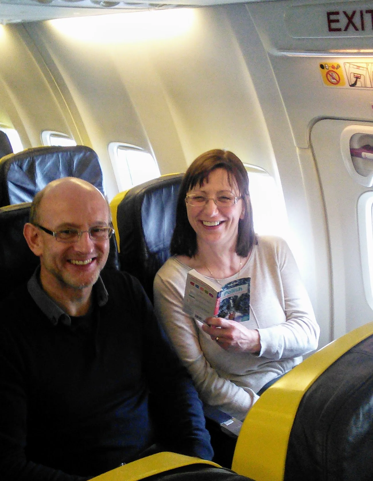 Sitting comfortably on our Ryanair flight! Anna is polishing up on her Polish!