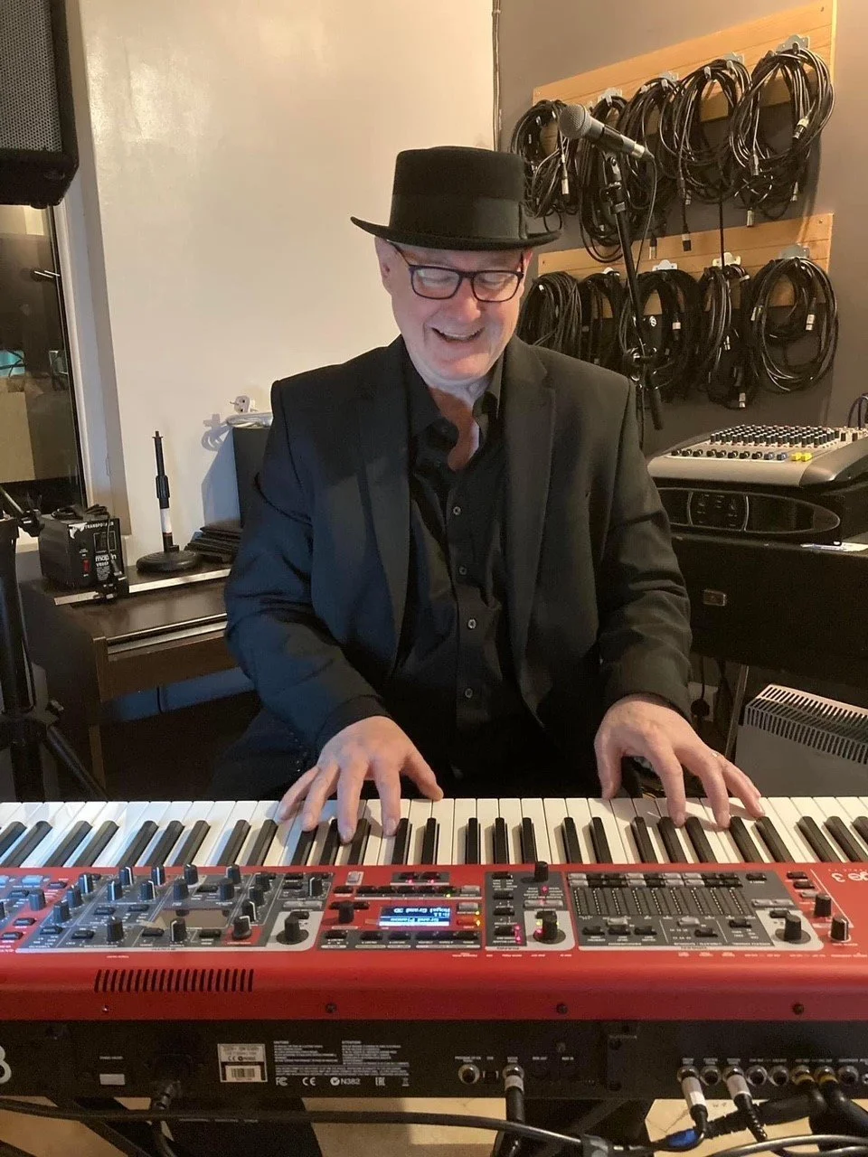 Kirk piano seated smile.jpg