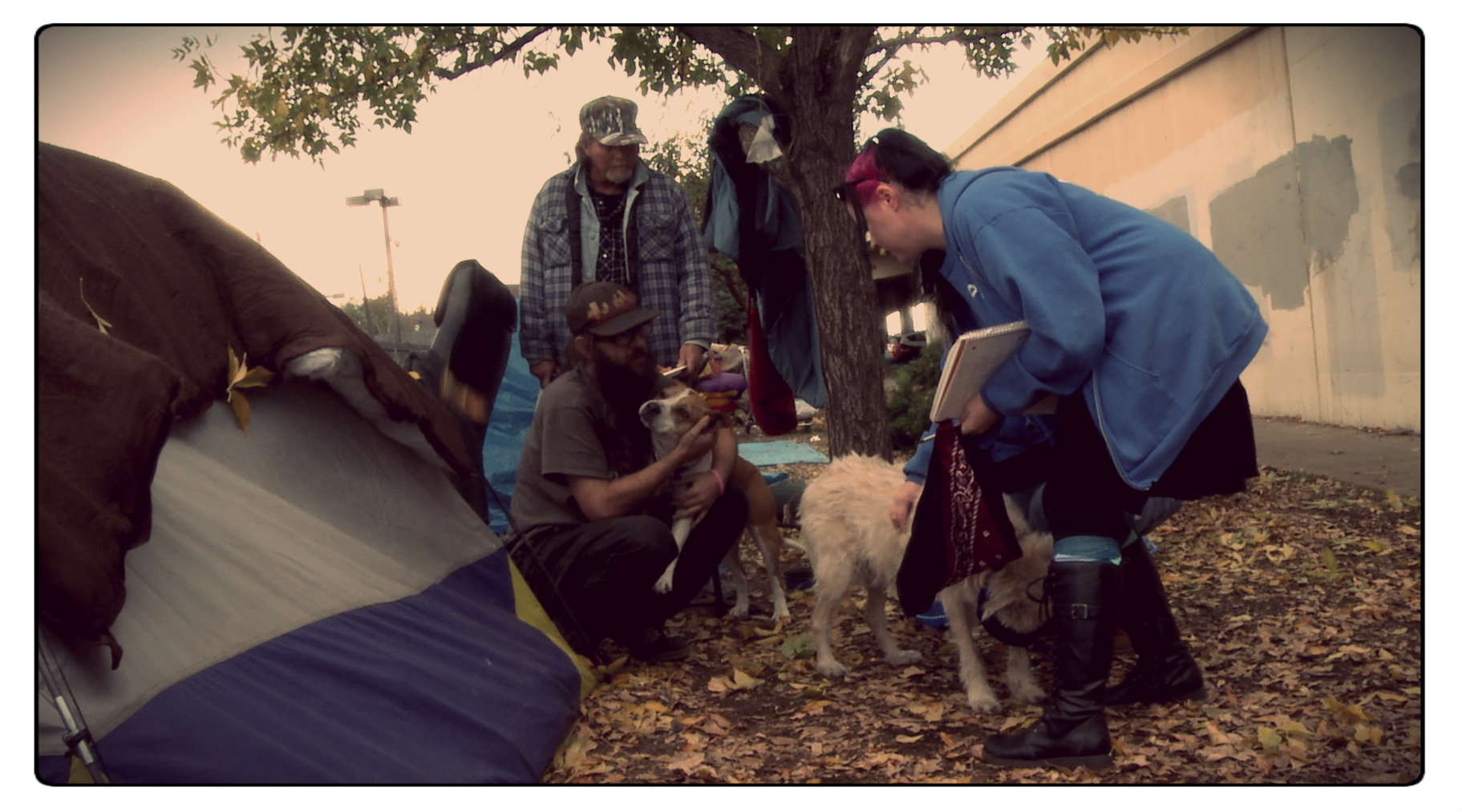 Tent city residents receive a visit from workers of the Nevada Humane Society who check up on their pets.