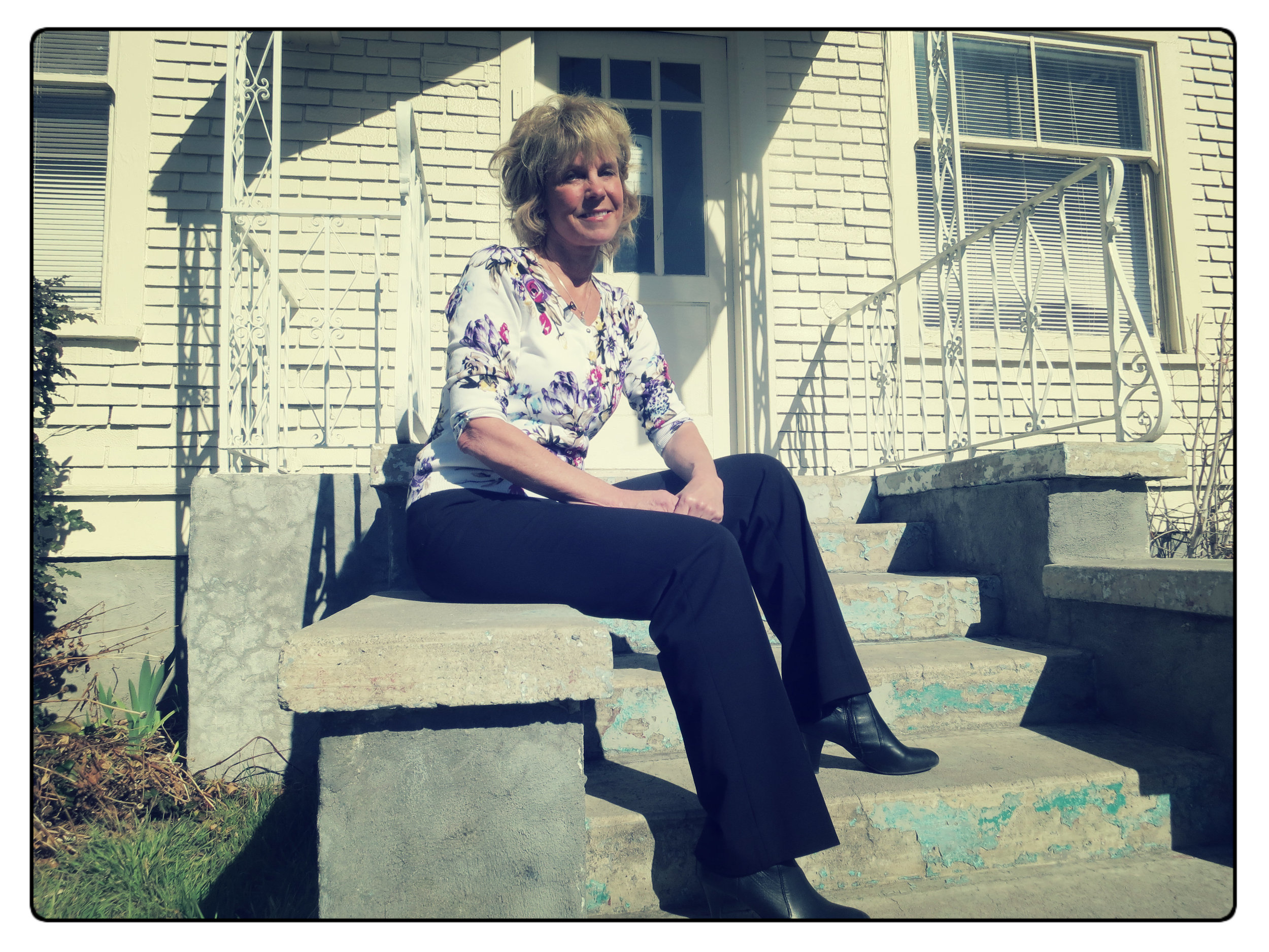 Lynette Eddy sits in front of the You, a resource center for at-risk, runaway and homeless kids which opened last year.