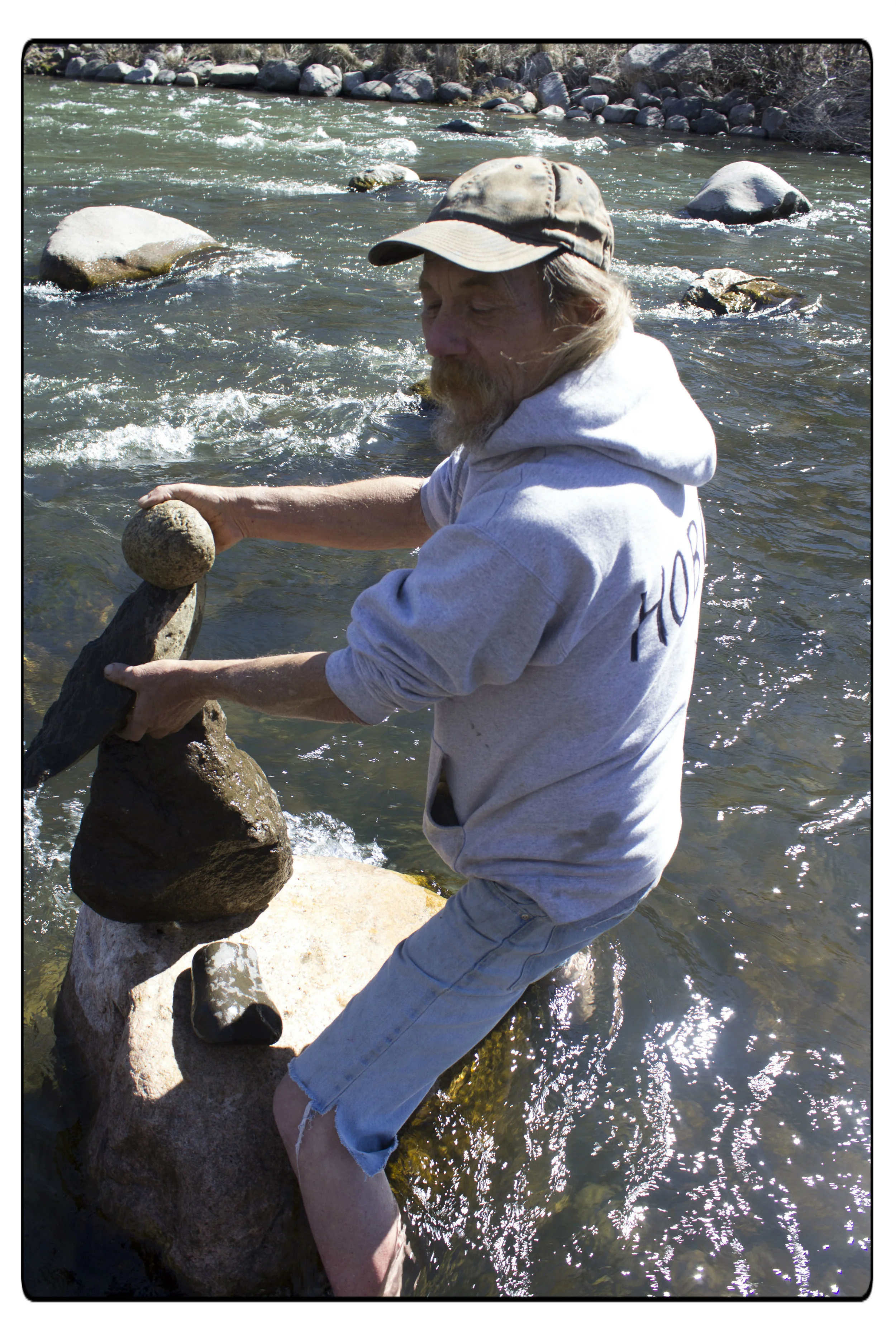Hobo was making a rock sculpture on a big rock in the Truckee river in February 2016. Photo by Camille Loustalet