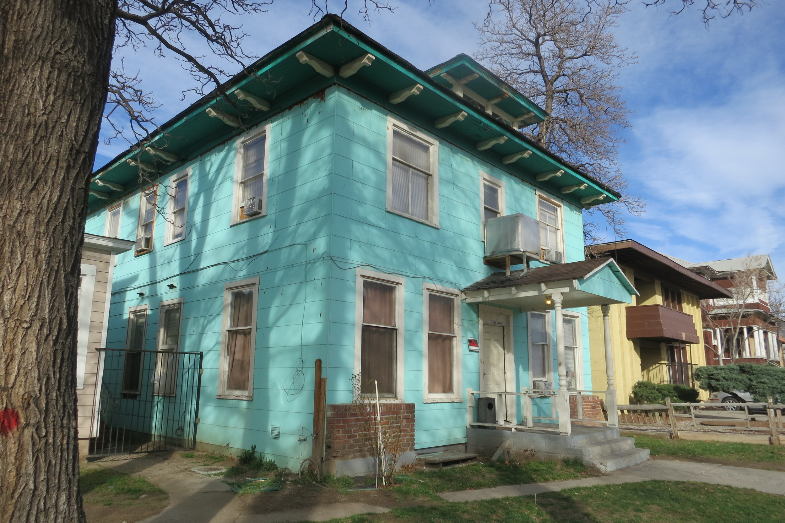 Trees have red dots on them, seemingly indicating these will be cut down, while the old homes have no trespassing signs.