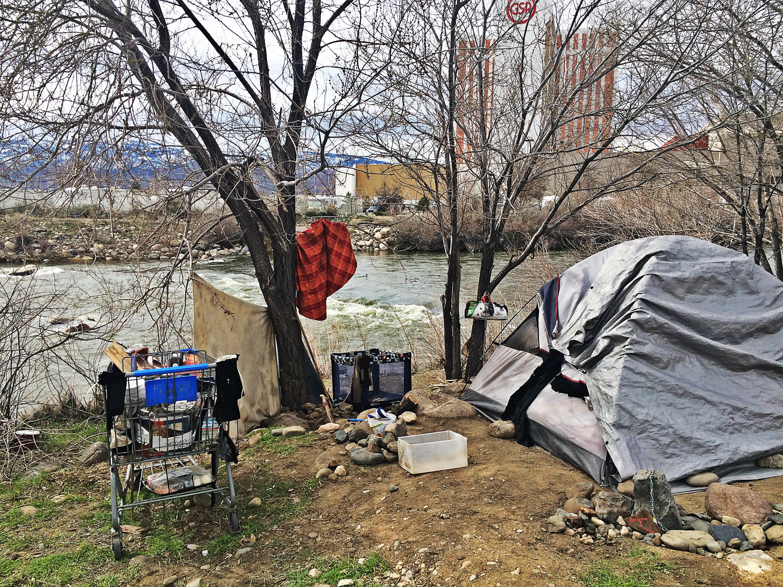 Authorities in Sparks are considering shutting down this encampment site, which keeps reappearing, along the Truckee River. Photo by Monica Gomez