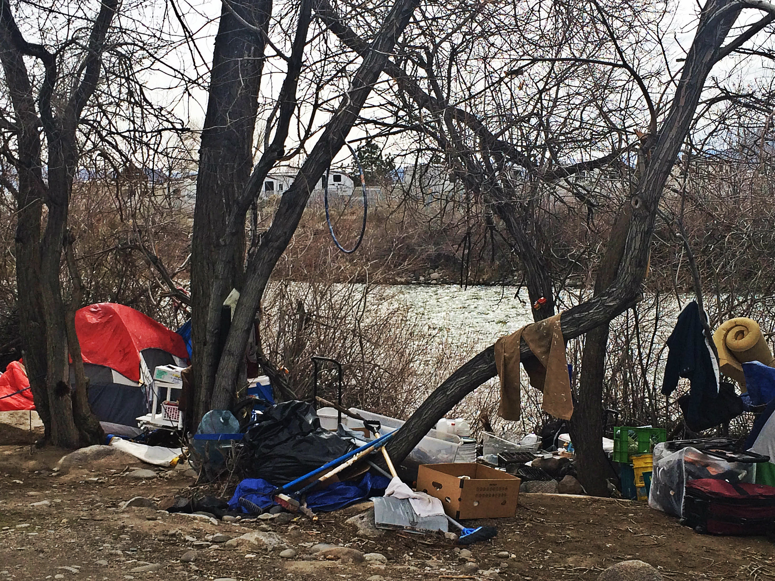 Belongings and tents may soon be removed, but where will the people now living here go? Photo by Monica Gomez